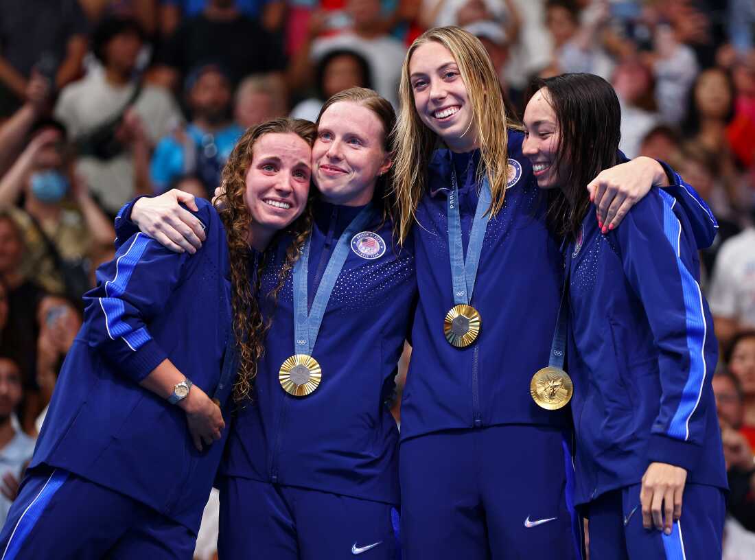 NANTERRE, FRANCE - AUGUST 04: Gold Medalists Regan Smith, Lilly King, Gretchen Walsh and Torri Huske of Team United States celebrate on the podium during the Swimming medal ceremony after the Women’s 4x100m Medley Relay Final on day nine of the Olympic Games Paris 2024 at Paris La Defense Arena on August 04, 2024 in Nanterre, France. (Photo by Maddie Meyer/Getty Images)